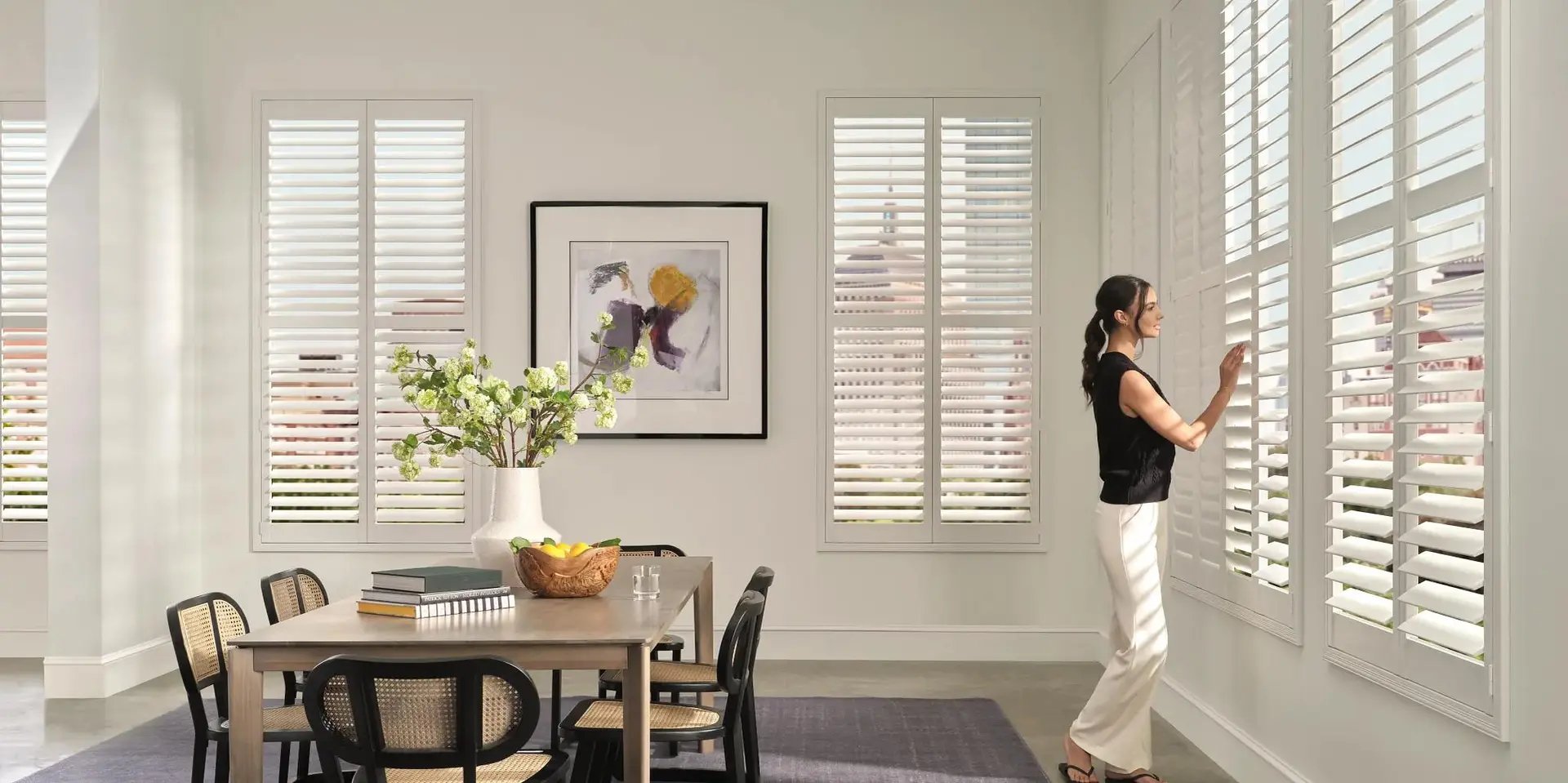 White plantation shutters in a bright dining room